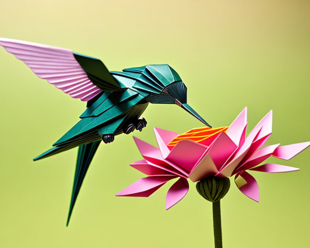 Origami hummingbird and flower on green background