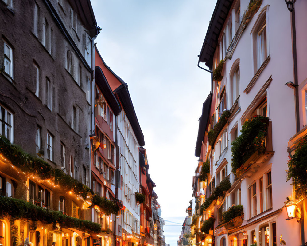 Picturesque European Street with Illuminated Buildings at Dusk