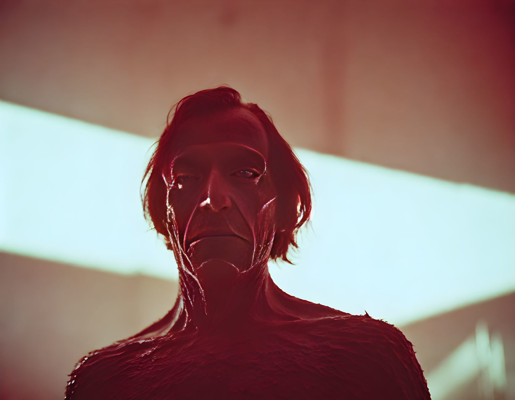 Red-tinted figure in textured attire under dramatic lighting