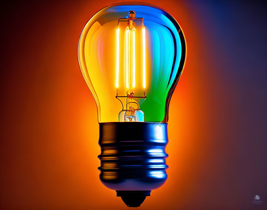 Colorful Gradient Lightbulb Glowing on Orange Background