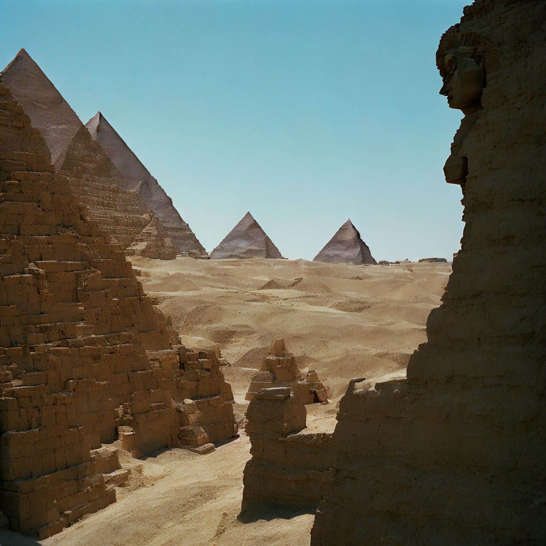 Egyptian Pyramids and Sphinx under Clear Sky