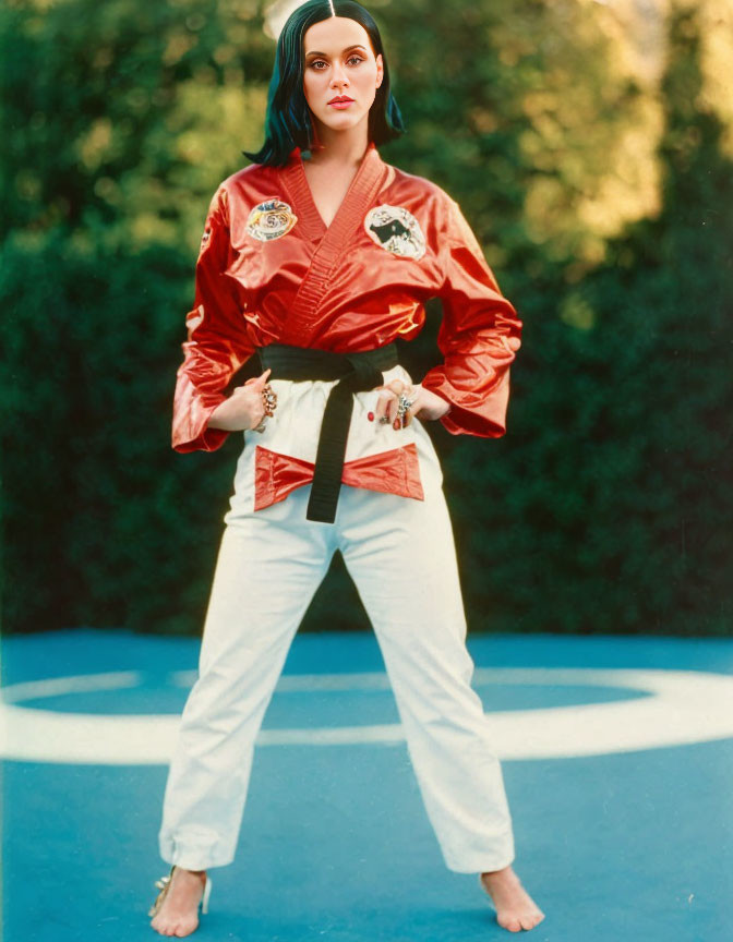 Confident Woman in Red Karate Gi on Martial Arts Mat