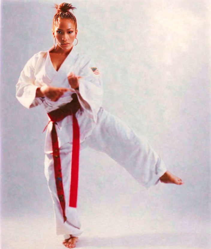 Karate practitioner in red and black belt performing high kick pose.