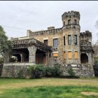 Ivy-covered fairytale castle in verdant landscape