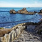 Serene Coastal Landscape with Rocky Outcrops and Blue Ocean