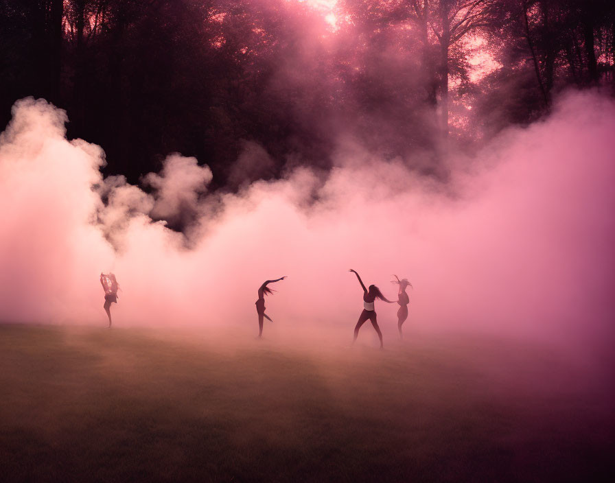 Silhouetted figures dancing in mystical pink and white fog forest clearing