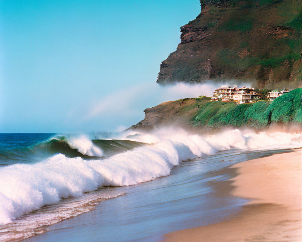 Tranquil beach scene with rolling waves, clear sky, and cliffside houses.