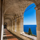 European Coastal Town: Arched Passageway Overlooking Sea & Sailboat