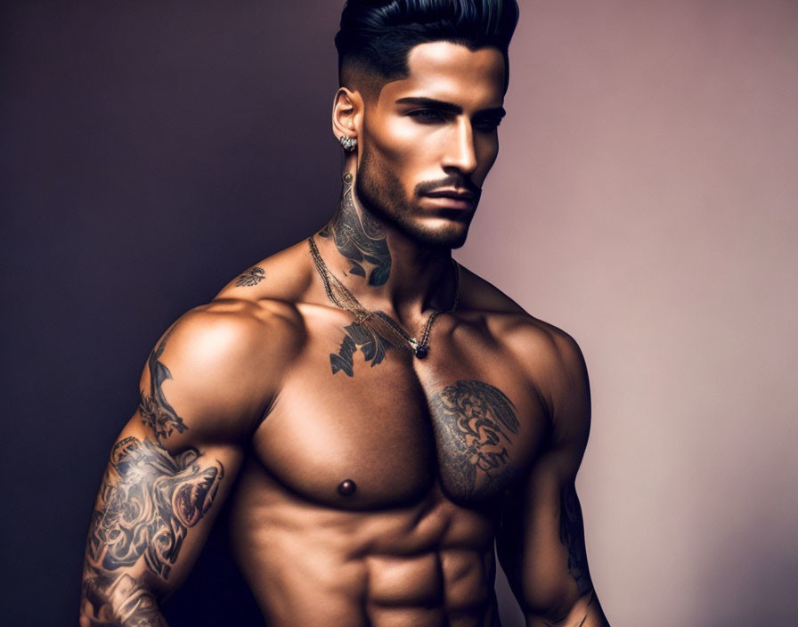 Muscular shirtless man with tattoos, beard, styled hair, side glance, brown background