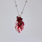 Heart-Shaped Red Gemstones on White Surface Display