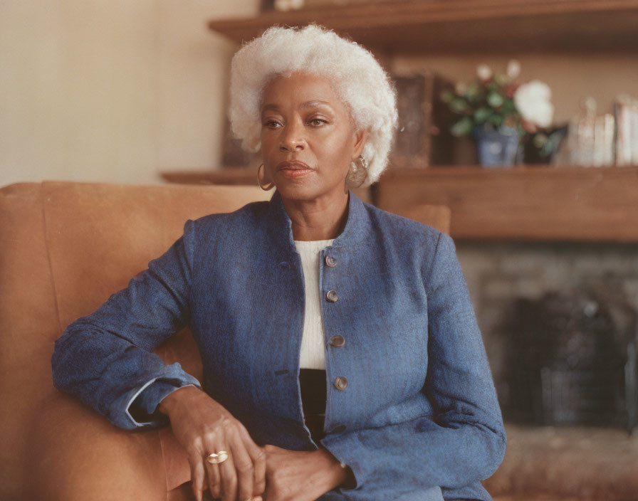 Elderly Woman in Blue Blazer Sitting on Couch