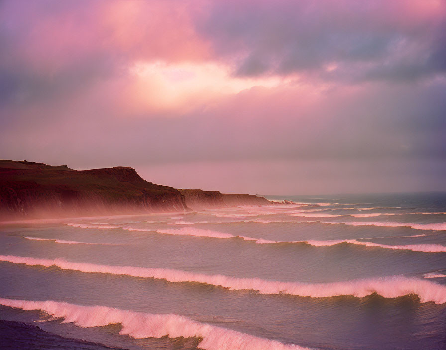 Soft Pastel Sky Overlooking Serene Shoreline