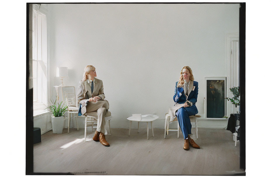 Business professionals having a discussion in a minimalist office setting