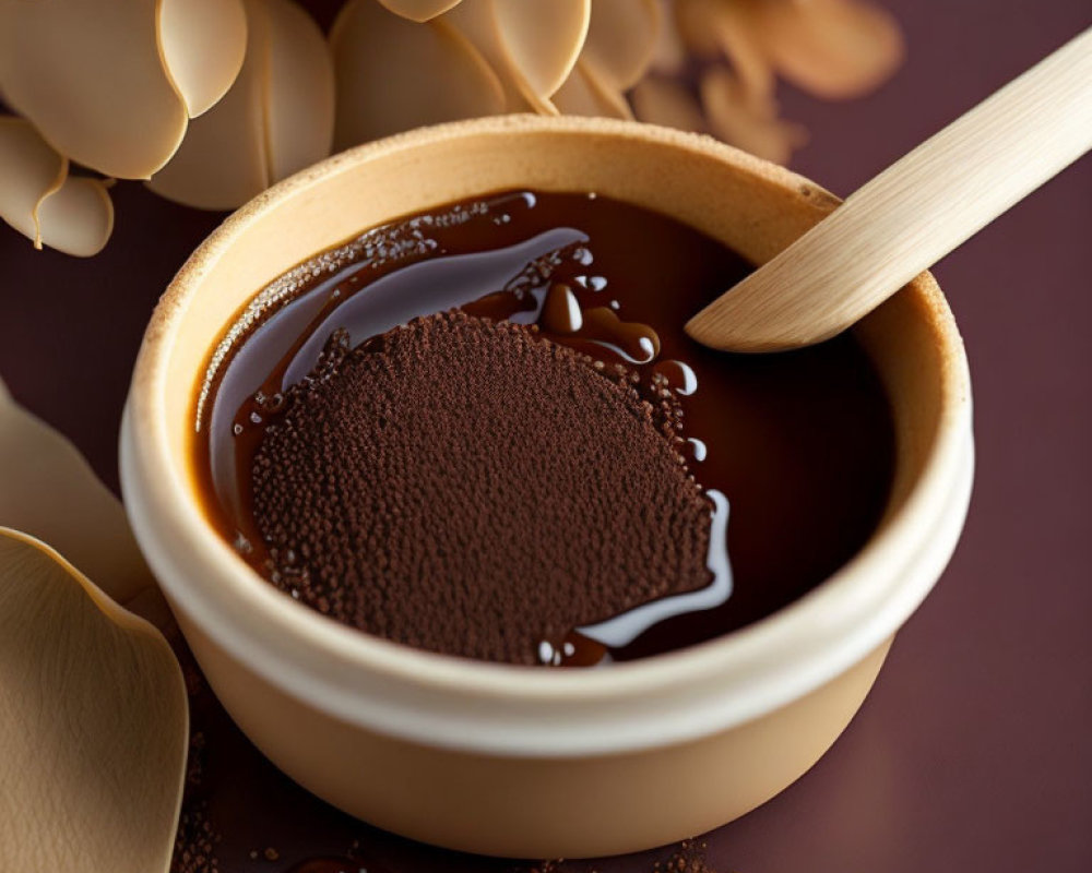 Silky Chocolate Ganache Bowl with Cocoa Powder and Wooden Spoon