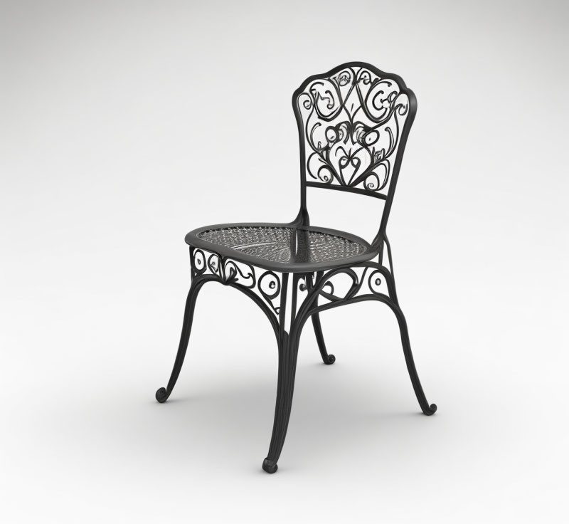 Ornate black wrought iron chair with scroll and lattice designs