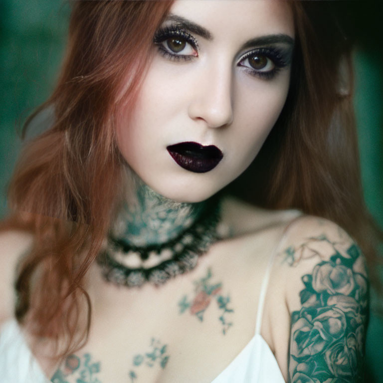 Auburn-Haired Woman with Tattoos and Choker on Green Background