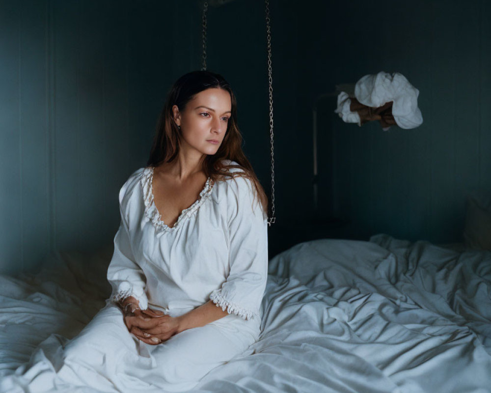 Woman on Swing in Dimly Lit Room with White Decor