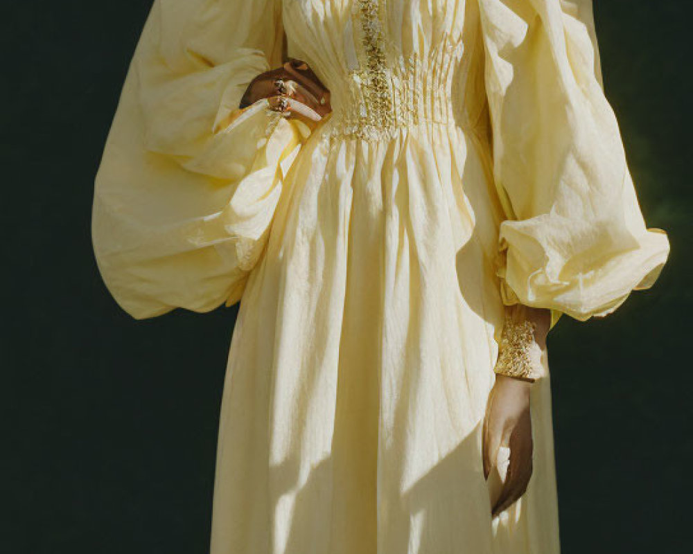 Woman in Yellow Dress with Puffed Sleeves and Floral Hairpiece