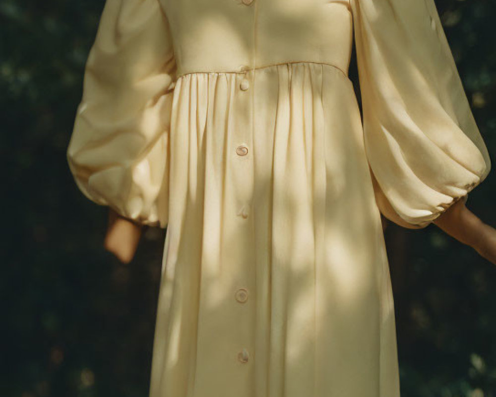 Woman in Pale Yellow Dress with Gold Accessories in Forest