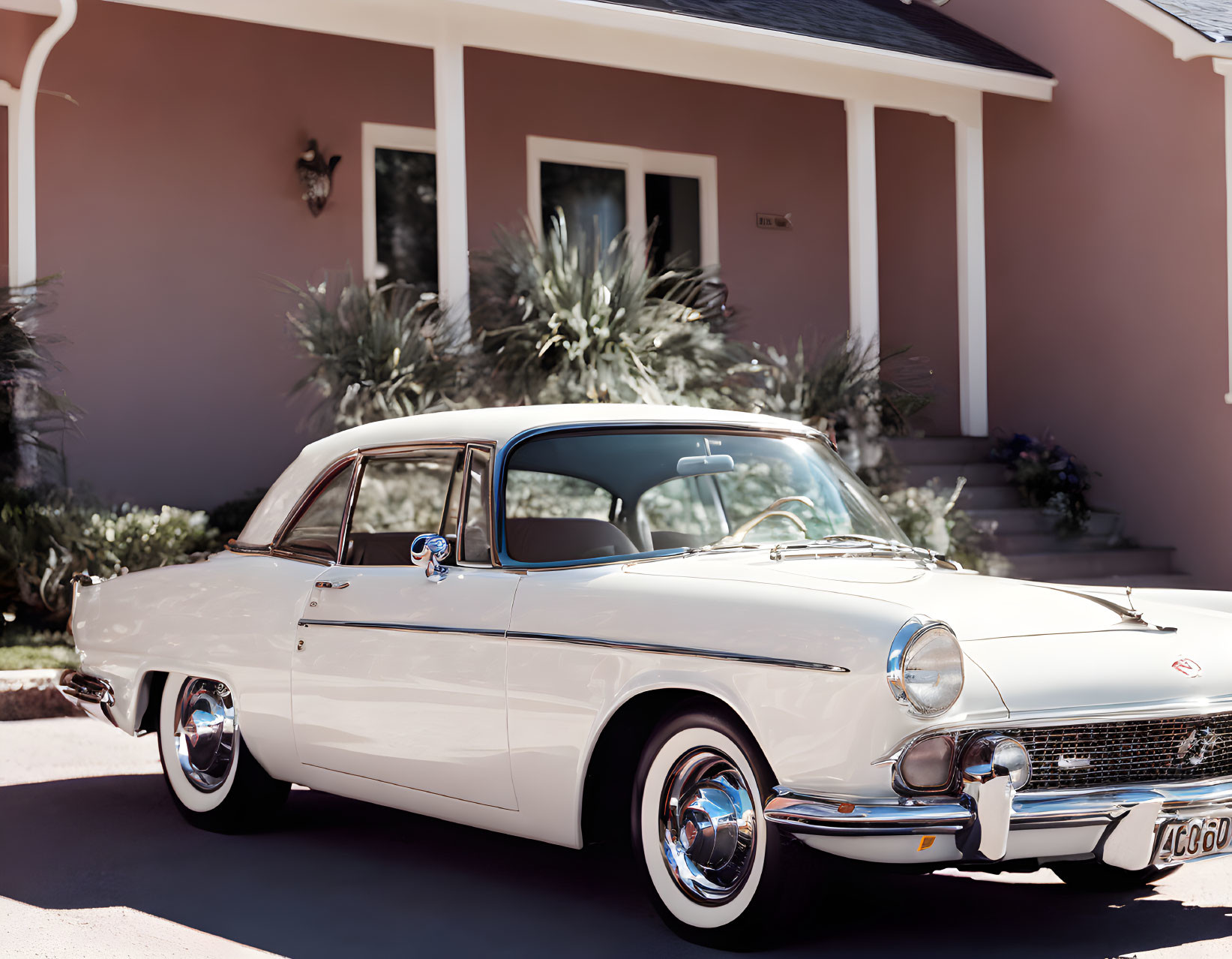 Vintage White Car Parked in Front of House with Terracotta Facade