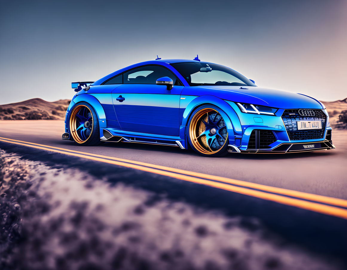 Blue Audi sports car with aftermarket wheels on desert highway at dusk