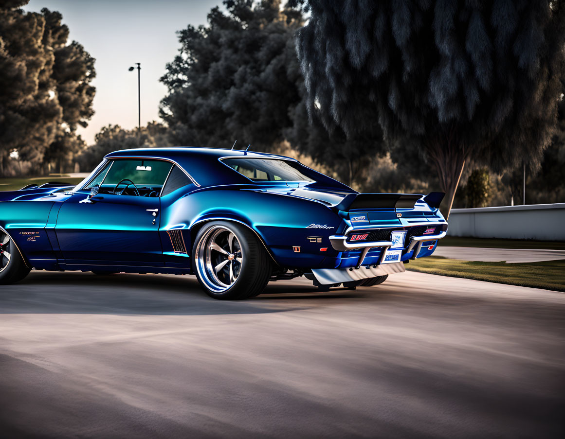 Vintage Blue Chevrolet Camaro Z/28 Speeding on Road at Dusk