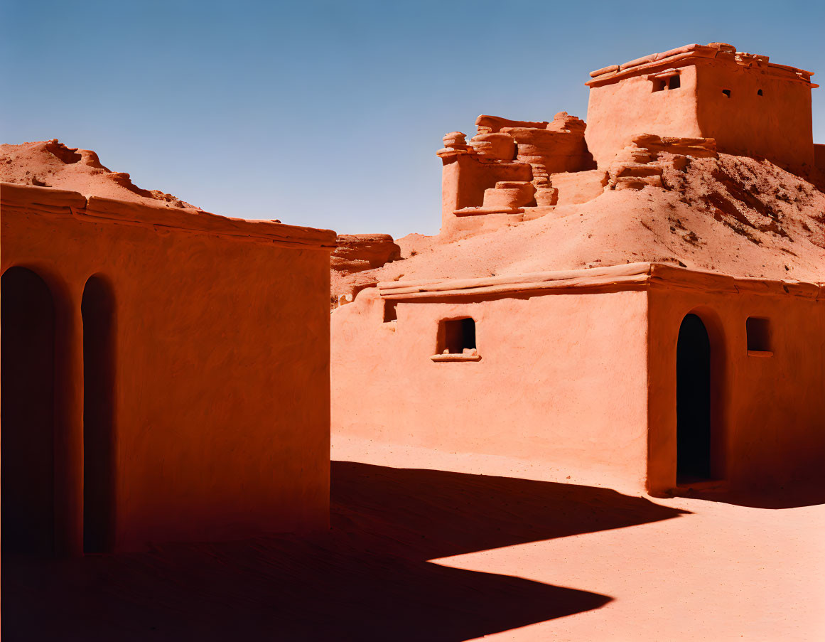 Adobe Buildings in Terracotta Color Against Desert Sky