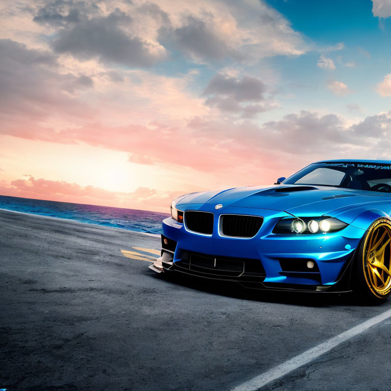 Blue sports car parked on coastal road at sunset with vivid sky