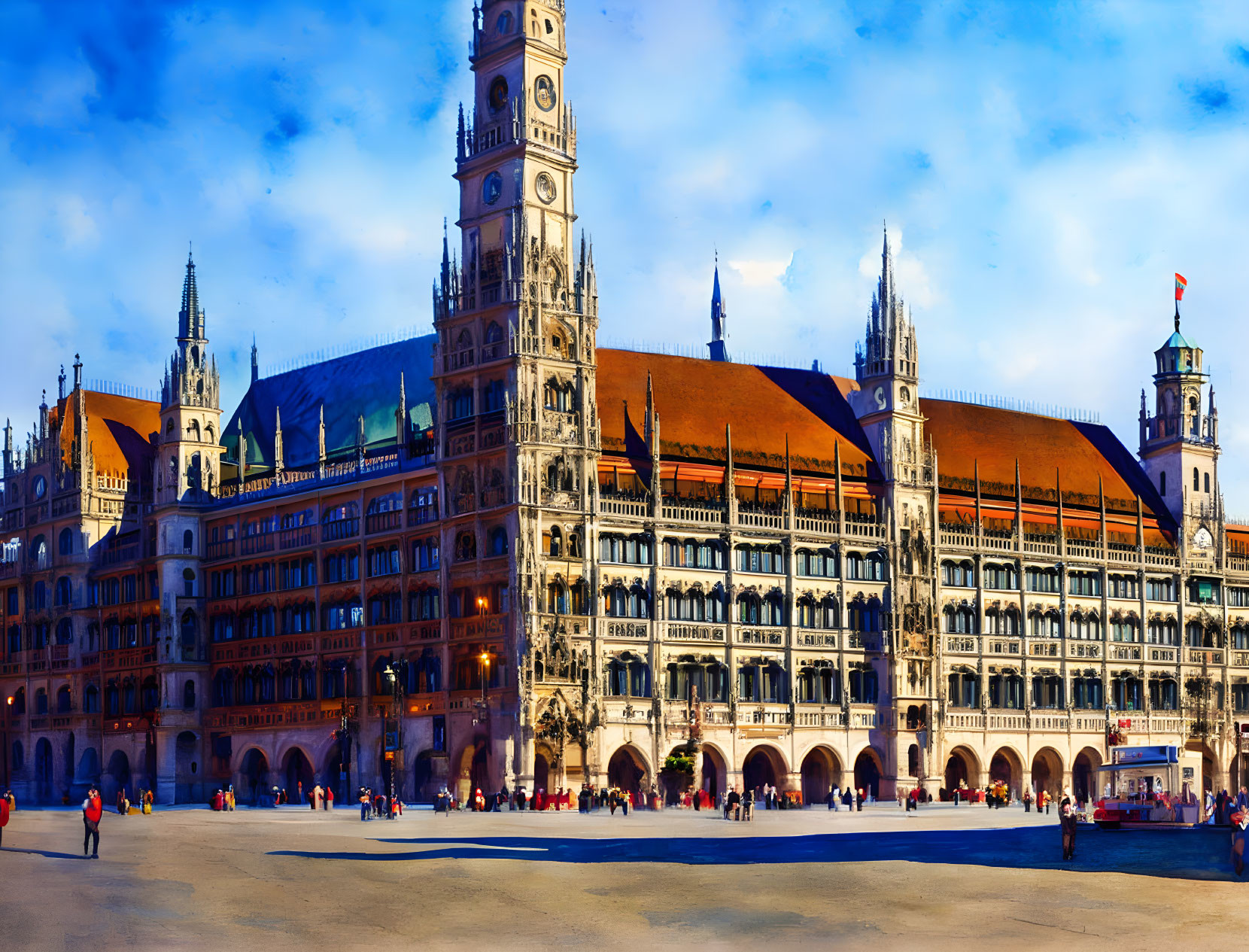 Ornate Gothic Revival New Town Hall in Munich with tower and blue sky