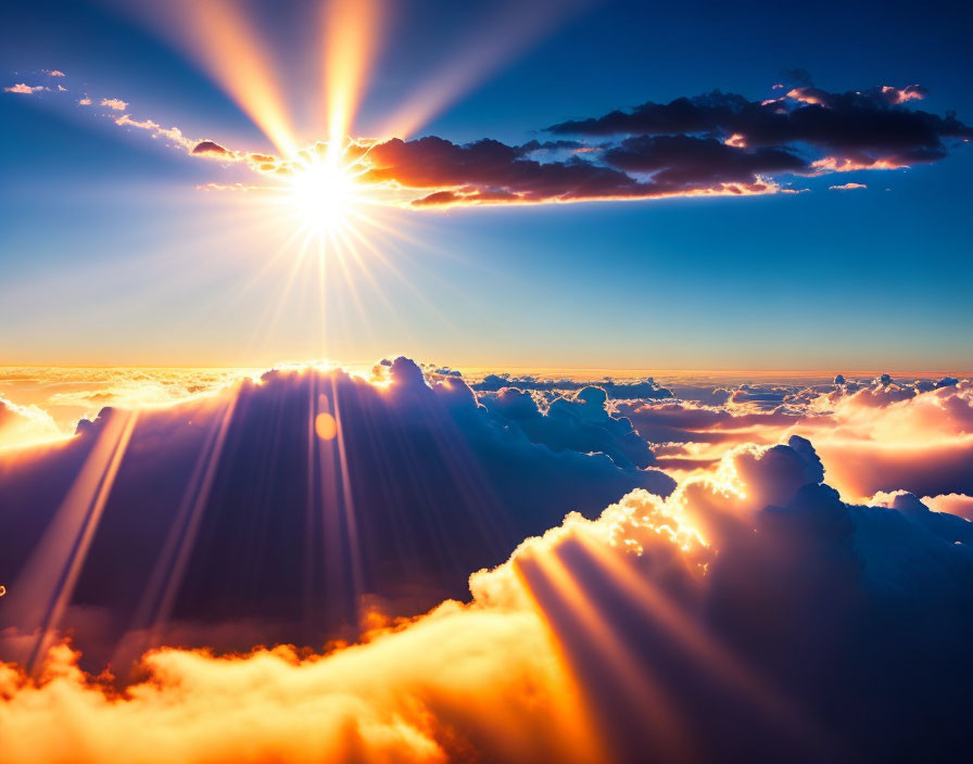 Vivid Sunrise Above Fluffy Clouds and Sunbeams