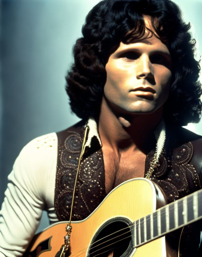 Curly-Haired Man with Guitar in Ornate White Vest