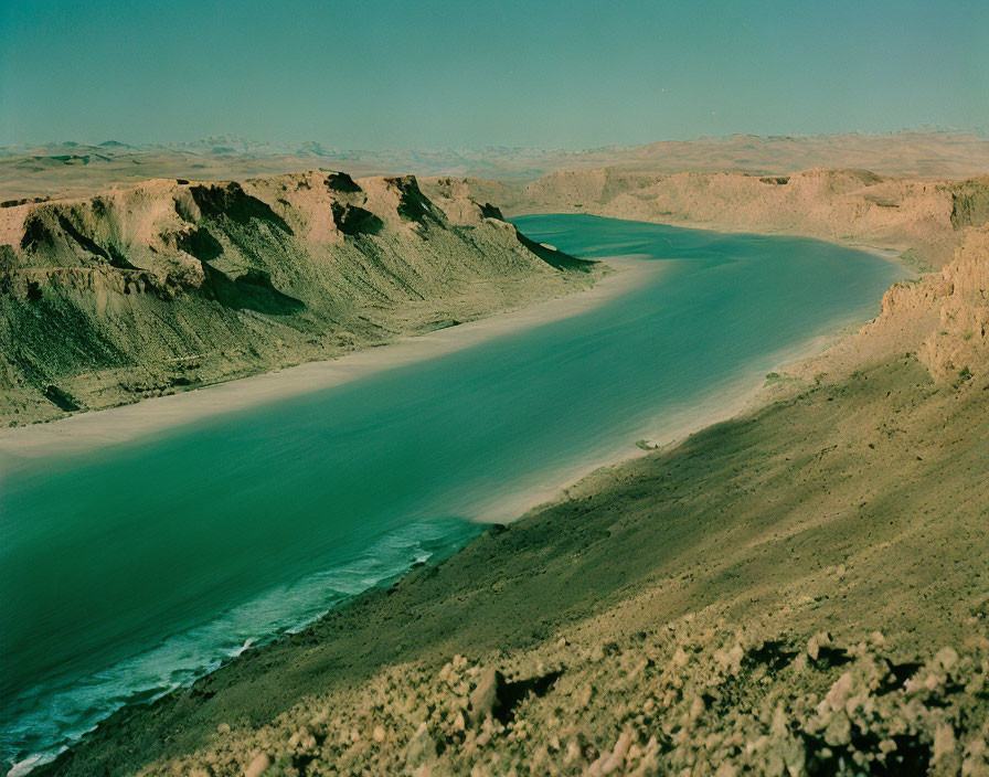 Winding River in Rugged Desert Landscape