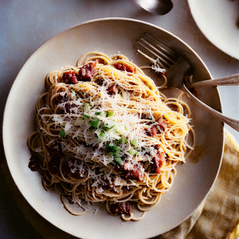 Spaghetti with Meaty Tomato Sauce and Cheese Garnished with Herbs