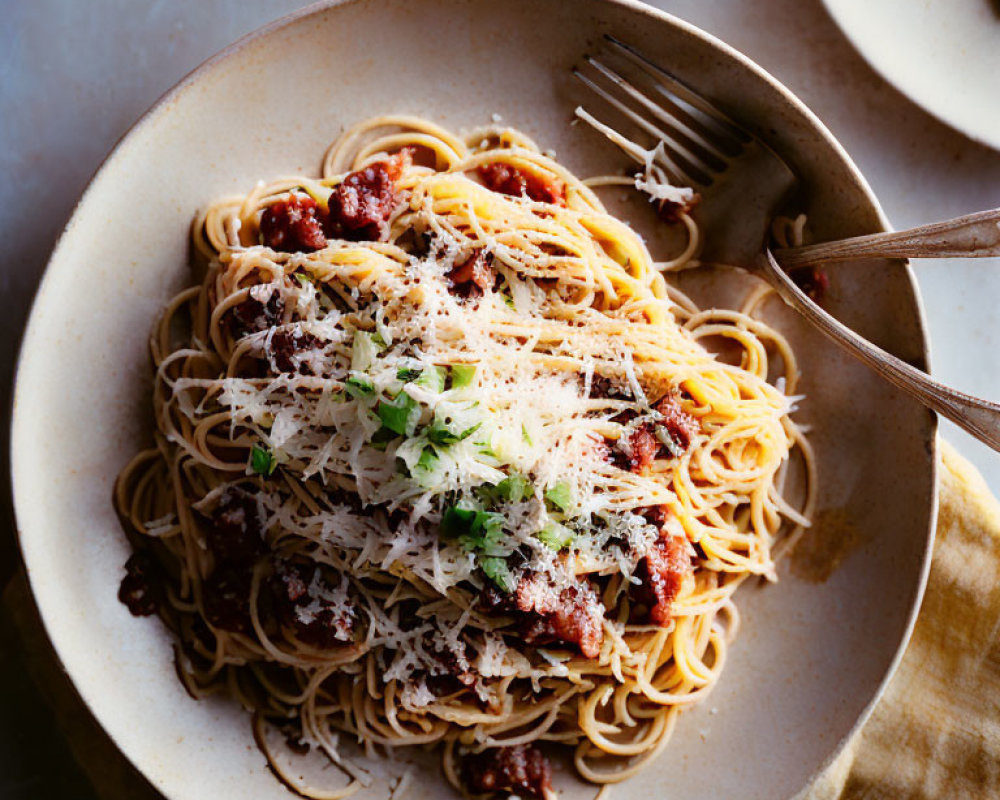 Spaghetti with Meaty Tomato Sauce and Cheese Garnished with Herbs