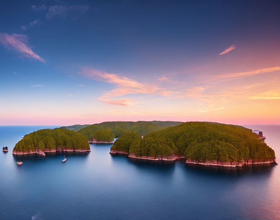 Tranquil Coastal Sunrise with Forest-Covered Islands