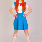 Anime female character with red hair, white top, blue skirt, and white boots