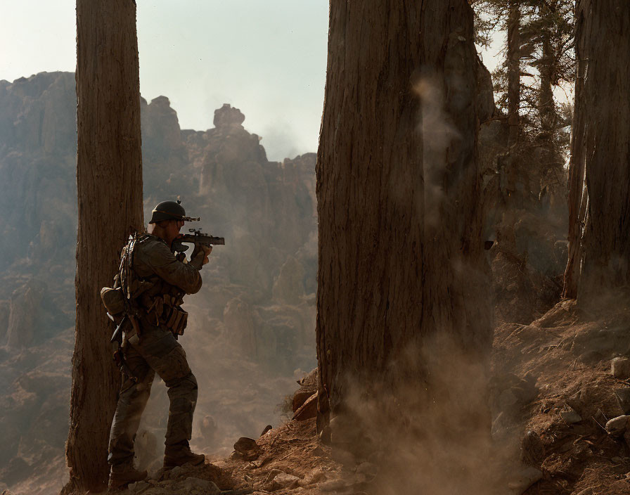 Camouflaged soldier with rifle in rocky terrain.