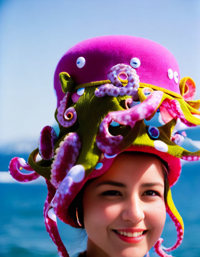 Colorful Octopus Hat Woman Smiling on Blue Background