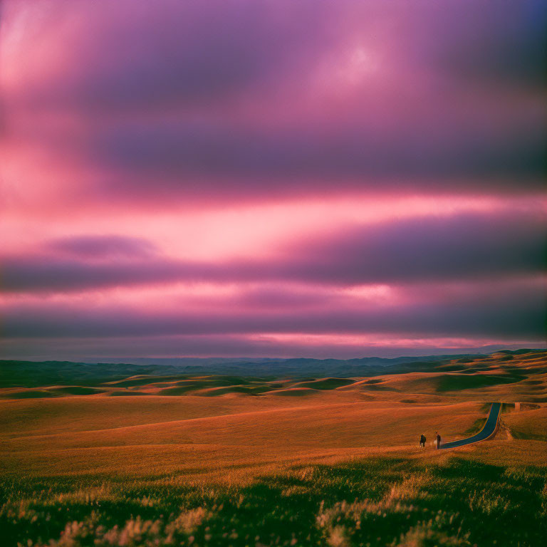 Vibrant purple and pink sky over surreal landscape with rolling hills and figures