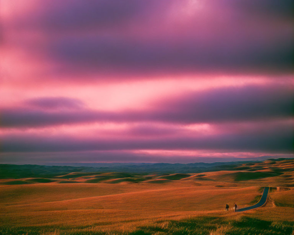 Vibrant purple and pink sky over surreal landscape with rolling hills and figures