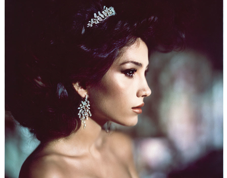 Voluminous hair woman with jeweled tiara and earrings portrait