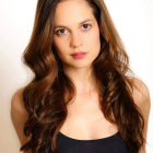 Portrait of a Woman with Wavy Brown Hair and Green Eyes