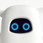 Fluffy animated white creature with big blue eyes and tiny black pupils