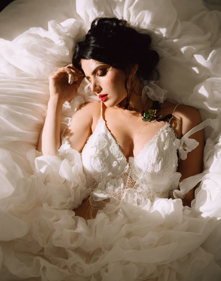 Woman in White Lace Garment Resting in Sunlit Setting