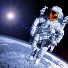 Astronaut in white spacesuit with dandelion in space scenery