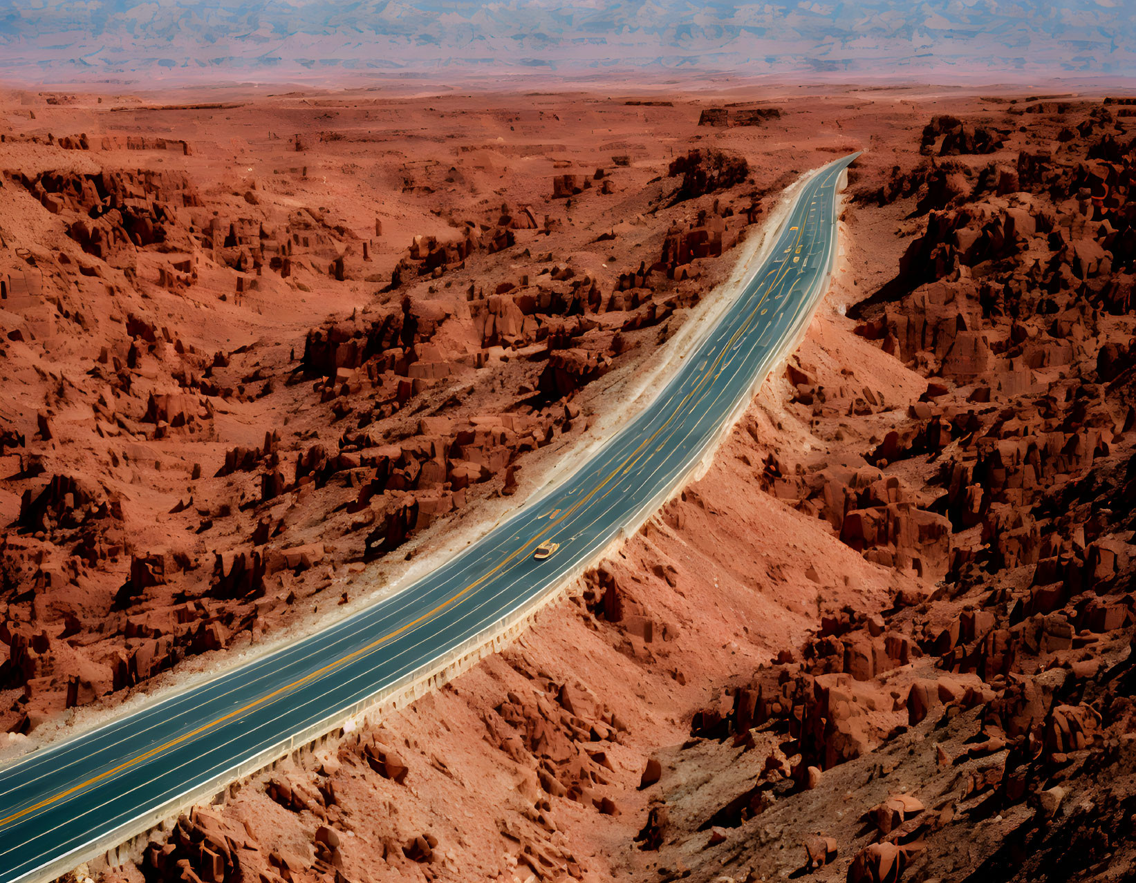 Scenic winding road through rugged red desert landscape