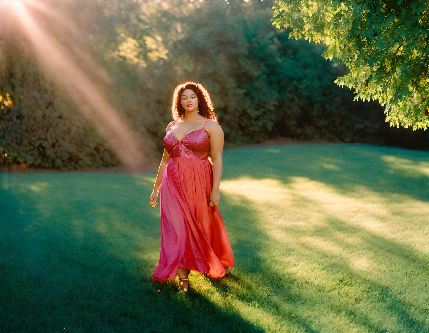 Woman in Pink Dress Standing in Sunlit Garden