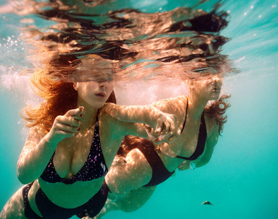 Underwater Scene: Two People Swimming with Flowing Hair