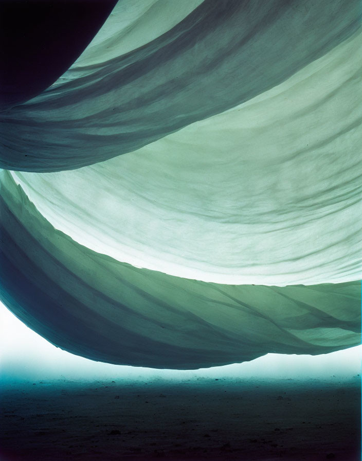 Sandy dunes under dimly lit sky: Light and shadow hues