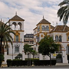 Ornate Castle with Blue and Gold Domes in Landscaped Gardens